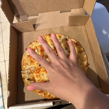 Lost Pizza Co. - a hand reaching for a piece of pizza - Salad Near Me - Miramar Beach, Florida Lost Pizza Co. - a hand reaching for a piece of pizza - Salad Near Me - Miramar Beach, Florida