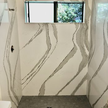 Grima Tile & Stone - a bathroom with a window - Flooring Near Me - Cotati, California