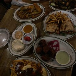 Hayward House Bistro - Top to bottom: Artichoke, brussels sprouts, eggplant sandwich, whipped feta with bread, chili croquettes, and poutine.