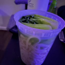 a cup of noodles and cucumbers a cup of noodles and cucumbers