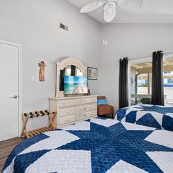 Conroe Lakefront Cottage - This guest room also includes a smart TV with premium cable and local channels--perfect for relaxing after a fun-filled day on the lake!