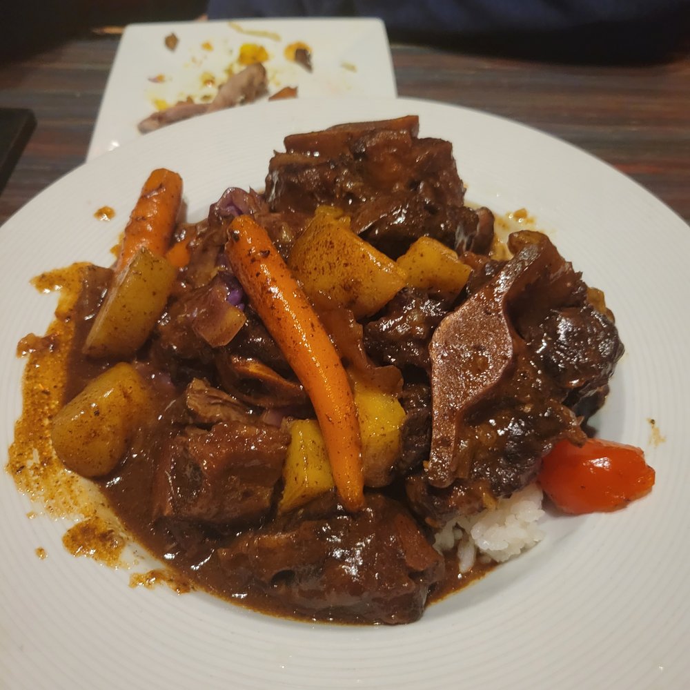 Sisserou's Caribbean Restaurant & Catering - Stewed Oxtail - Caribbean Near Me - Tulsa, Oklahoma Sisserou's Caribbean Restaurant & Catering - Stewed Oxtail - Caribbean Near Me - Tulsa, Oklahoma