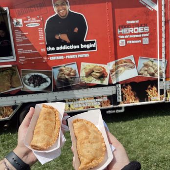 Empanada Guy - two people holding sandwiches in front of a food truck - Food Trucks Near Me - Woodbridge Township, New Jersey Empanada Guy - two people holding sandwiches in front of a food truck - Food Trucks Near Me - Woodbridge Township, New Jersey