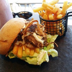 St Rose - The Pulled Lamb Burger with aioli, lettuce, crispy onion strings and a side of chips.