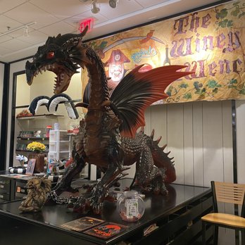 The Winey Wench - a dragon on a table - Beer, Wine & Spirits Near Me - Sanford, Florida