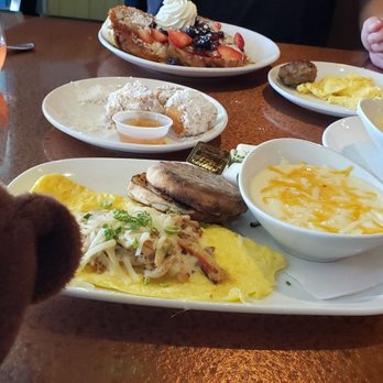 Another Broken Egg Cafe - The Floridian Omelette!! It's topped with Jack cheese, a light champagne garlic sauce and lump crab meat. - Breakfast & Brunch Near Me - Burbank, California