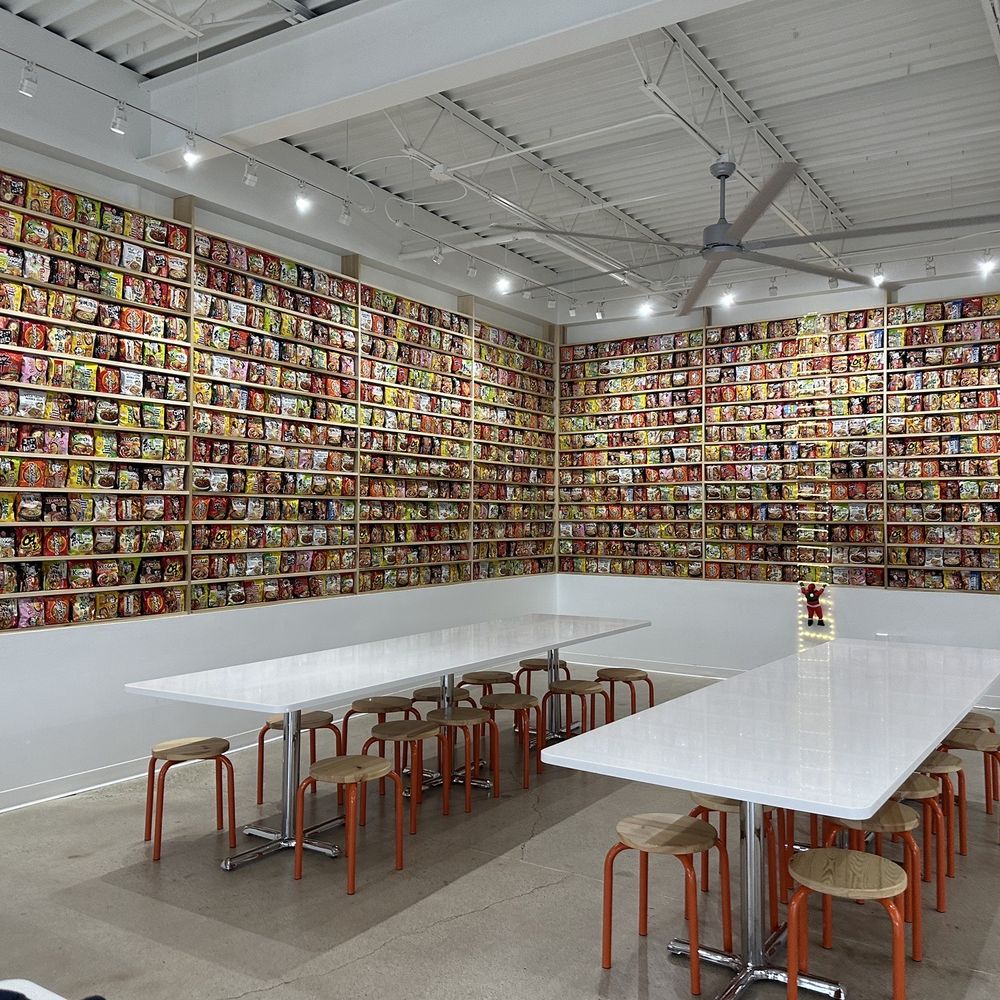 The Ramyun Library - a long table in front of a wall of books - Ramen Near Me - Carrollton, Texas The Ramyun Library - a long table in front of a wall of books - Ramen Near Me - Carrollton, Texas