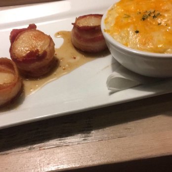 DRY 85 OC - Bourbon maple glazed bacon wrapped scallops with cheesy grits. - New American Near Me - Ocean City, Maryland DRY 85 OC - Bourbon maple glazed bacon wrapped scallops with cheesy grits. - New American Near Me - Ocean City, Maryland
