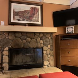 Lake Arrowhead Chalets - Stone fireplace and tv