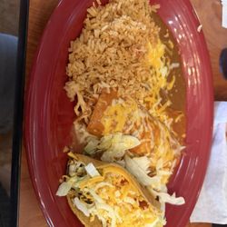 Combo #2 Shredded chicken enchilada and shredded beef taco, beans and rice included.