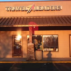 Travel Leaders - Storefront. Located in Village Square next to At&t and Year Round Brown.