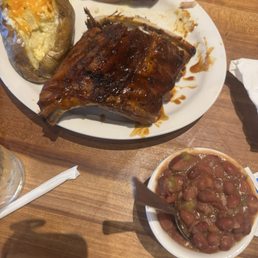 Ribs, baked potato and beans