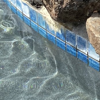 Renova Pool Tile Cleaning - Before cleaning. Build up beneath the rock waterfall - Pool Cleaners Near Me - Sacramento, California Renova Pool Tile Cleaning - Before cleaning. Build up beneath the rock waterfall - Pool Cleaners Near Me - Sacramento, California