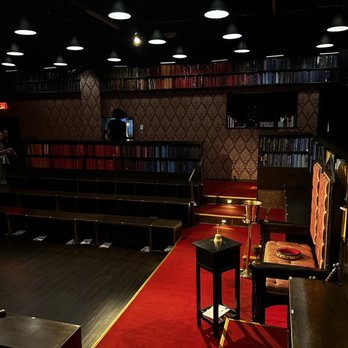 Drunk Shakespeare - Phoenix - a red carpeted stage with chairs and a red carpet - Comedy Clubs Near Me - Phoenix, Arizona