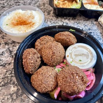 Cafe Petra - Katy - a bowl of fried food and a bowl of dips - Lebanese Near Me - Katy, Texas Cafe Petra - Katy - a bowl of fried food and a bowl of dips - Lebanese Near Me - Katy, Texas