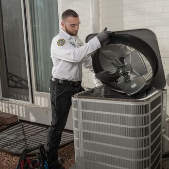 Youngberg's One Hour Heating & Air Conditioning - Technician repairing AC - Heating & Air Conditioning/HVAC Near Me - Payette, Idaho Youngberg's One Hour Heating & Air Conditioning - Technician repairing AC - Heating & Air Conditioning/HVAC Near Me - Payette, Idaho