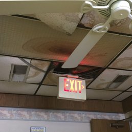 Water stained ceiling, broken ceiling tiles