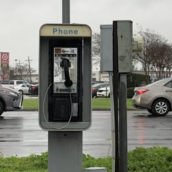 Otto's 7 - 2/19/19. Tuesday afternoon. Raining hard. 41 degrees. An outdoor standing payphone here for public use. All one needs is some quarters.
