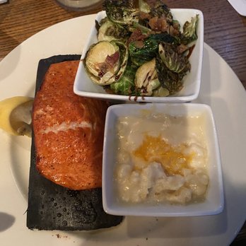 Hickory Tavern - Oregon cedar salmon, Brussels sprouts, smoked Gouda Mac n Cheese Drink: Spiked apple pie - Sports Bars Near Me - Asheville, North Carolina Hickory Tavern - Oregon cedar salmon, Brussels sprouts, smoked Gouda Mac n Cheese Drink: Spiked apple pie - Sports Bars Near Me - Asheville, North Carolina