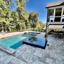 Creative PoolScape - Elevated Spa with spillover on all 4 sides.