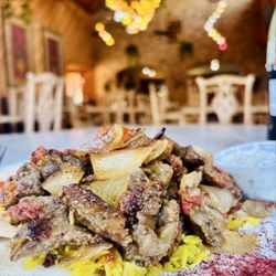 Tiba Grill - Gyro Platter with rice, sides including hummus, cucumber sauce and pita bread