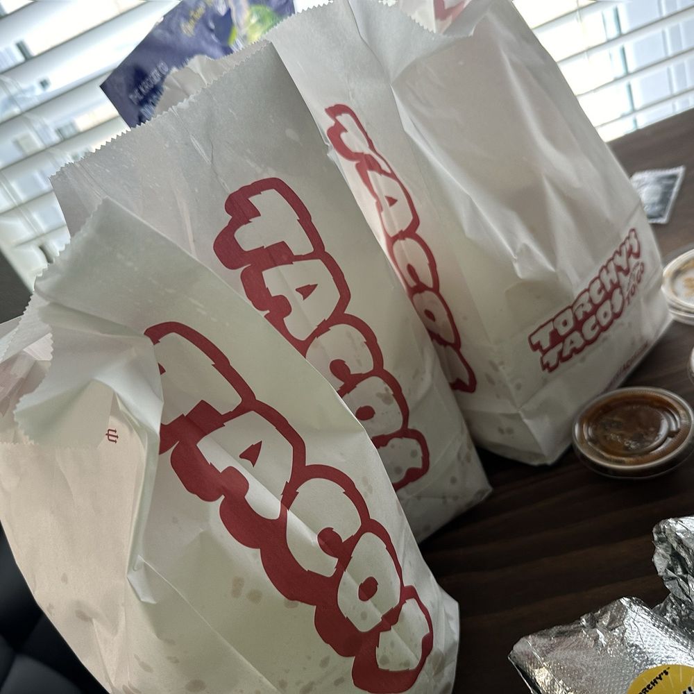 Torchy's Tacos - The queso and salsa came with a full bag of chips. - Tex-Mex Near Me - Houston, Texas Torchy's Tacos - The queso and salsa came with a full bag of chips. - Tex-Mex Near Me - Houston, Texas