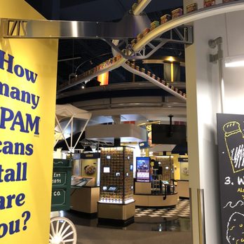 SPAM Museum - Bunch of cans of spams on the belt running - Museums Near Me - Austin, Minnesota