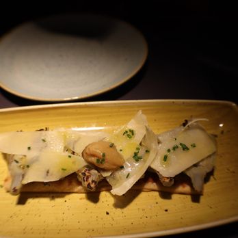 Juana la Loca - AMAZING! Grilled artichokes, shaved parmesan & confit garlic cloves on tender bread - Tapas/Small Plates Near Me - Madrid, M Juana la Loca - AMAZING! Grilled artichokes, shaved parmesan & confit garlic cloves on tender bread - Tapas/Small Plates Near Me - Madrid, M
