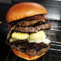 Wholly Cow Burgers - Colleran's smoked belly bacon double stacked burger ooozing with Cashel blue cheese...