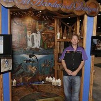 DM Hardwood Designs - a man standing in front of a display - Flooring Near Me - Farmington, New Mexico DM Hardwood Designs - a man standing in front of a display - Flooring Near Me - Farmington, New Mexico