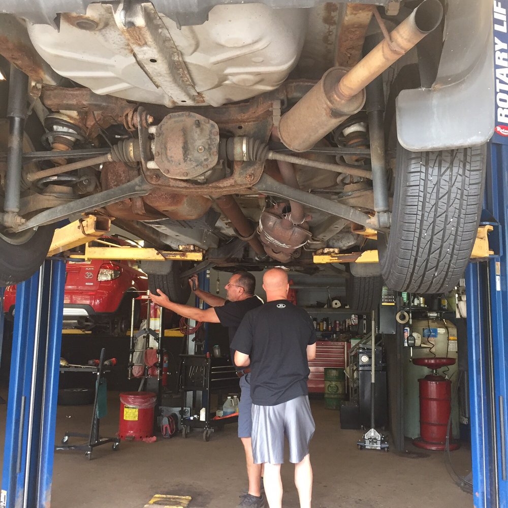 Midas - The mechanic showing my hubby the ugly underbelly of my car. - Auto Repair Near Me - Middletown, Connecticut