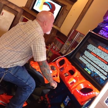 Barro's Pizza - Dad playing games while we wait for food - Pizza Near Me - Gilbert, Arizona Barro's Pizza - Dad playing games while we wait for food - Pizza Near Me - Gilbert, Arizona