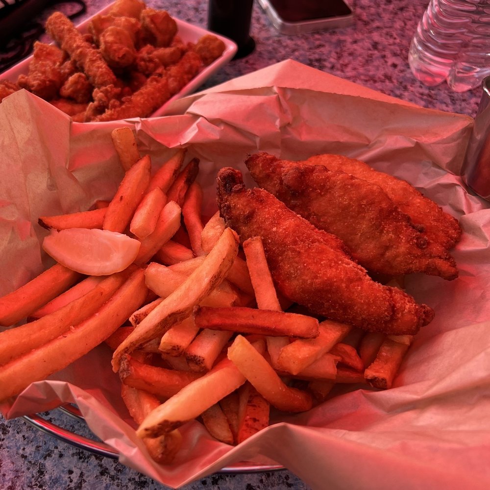 Ivar's Fish Bar - a basket of fried chicken and french fries - Seafood Near Me - Seattle, Washington Ivar's Fish Bar - a basket of fried chicken and french fries - Seafood Near Me - Seattle, Washington