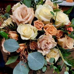 Carey's Cassville Florist - Soft hues of the fall, themed into this lovely bridal bouquet