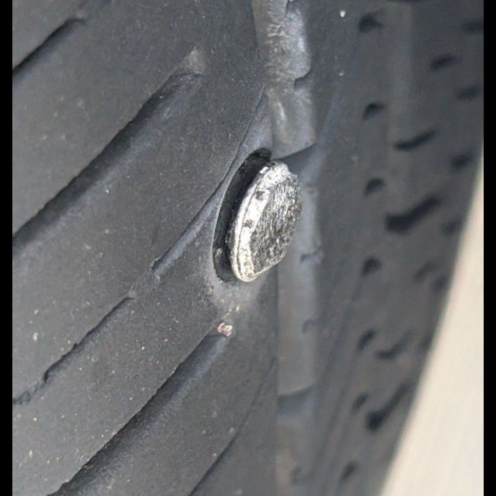 Nail in tire. Nail in tire.