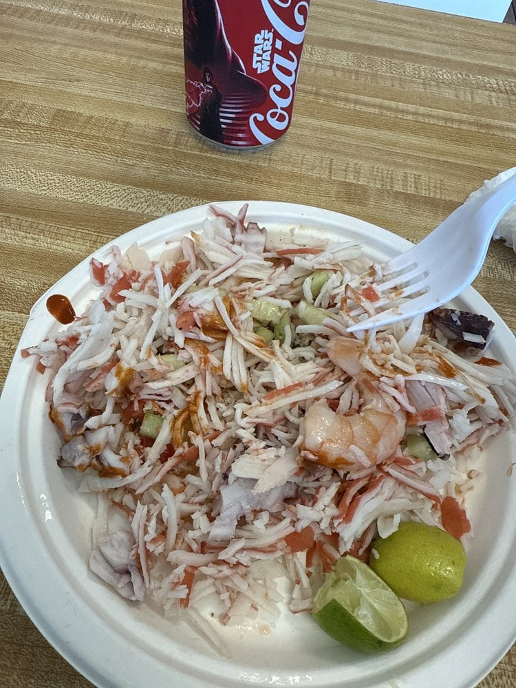 Lonchera De Mariscos El Kora Logo