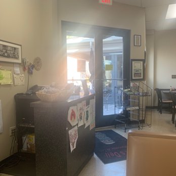Phil's Deli - a woman standing in a deli - Delis Near Me - Charlotte, North Carolina