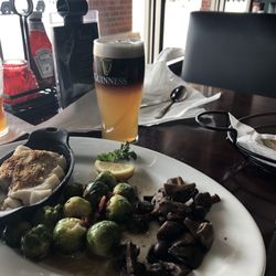 Corleones' Bar & Grill - Baked cod, mushrooms, and brussel sprouts. Dark Side of the Moon beer.