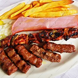 The Inn Between Bar & Grill - Cevapi with a skewer of kabob and a big chunk of ham.