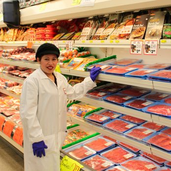 Food Town - a woman in a butcher shop - Grocery Near Me - Houston, Texas Food Town - a woman in a butcher shop - Grocery Near Me - Houston, Texas