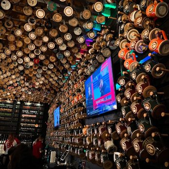 Baffin Brewing Company - a bar with a lot of beer kegs hanging from the ceiling - Breweries Near Me - Saint Clair Shores, Michigan