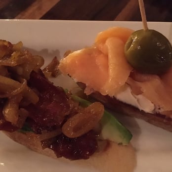 Taberna Tapas - Pintxos con pan.  Left: Spanish Chorizo & Avocado, shallots.  Right: Smoked Salmon - goat cheese, manzanilla olive. - Spanish Near Me - Durham, North Carolina