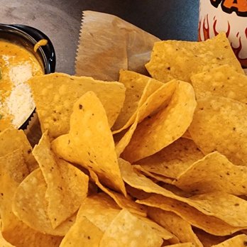 Torchy's Tacos - Green chile queso and chips. - Tex-Mex Near Me - Raleigh, North Carolina Torchy's Tacos - Green chile queso and chips. - Tex-Mex Near Me - Raleigh, North Carolina