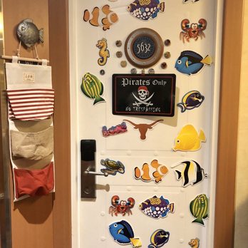 Disney Cruise Line - Our stateroom door with "fish extender" pockets for "pixie dust" gifts. Join the FB group for your cruise to get in a gifting group. - Tours Near Me - Galveston, Texas
