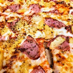 Domino's Pizza - The thin crust is perfect with the pineapple and Canadian bacon!!