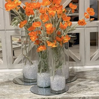 Poppy's Restaurant - Vases of silk poppies located at the greeting entryway. - American Near Me - Anaheim, California Poppy's Restaurant - Vases of silk poppies located at the greeting entryway. - American Near Me - Anaheim, California