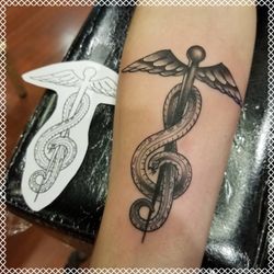 Rock of Ages Tattoos & Body Piercing