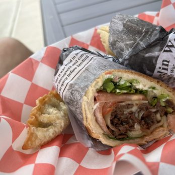Uptown Cafe - Dumpling and a half eaten steak and cheese. - Coffee & Tea Near Me - Chantilly , Virginia Uptown Cafe - Dumpling and a half eaten steak and cheese. - Coffee & Tea Near Me - Chantilly , Virginia