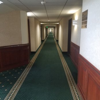 Rogue Regency Inn & Suites - hotel is a rectangle with rooms off to sides of a long internal hallway. - Hotels Near Me - Medford, Oregon Rogue Regency Inn & Suites - hotel is a rectangle with rooms off to sides of a long internal hallway. - Hotels Near Me - Medford, Oregon