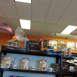 shelves of coffee and other items in a store shelves of coffee and other items in a store